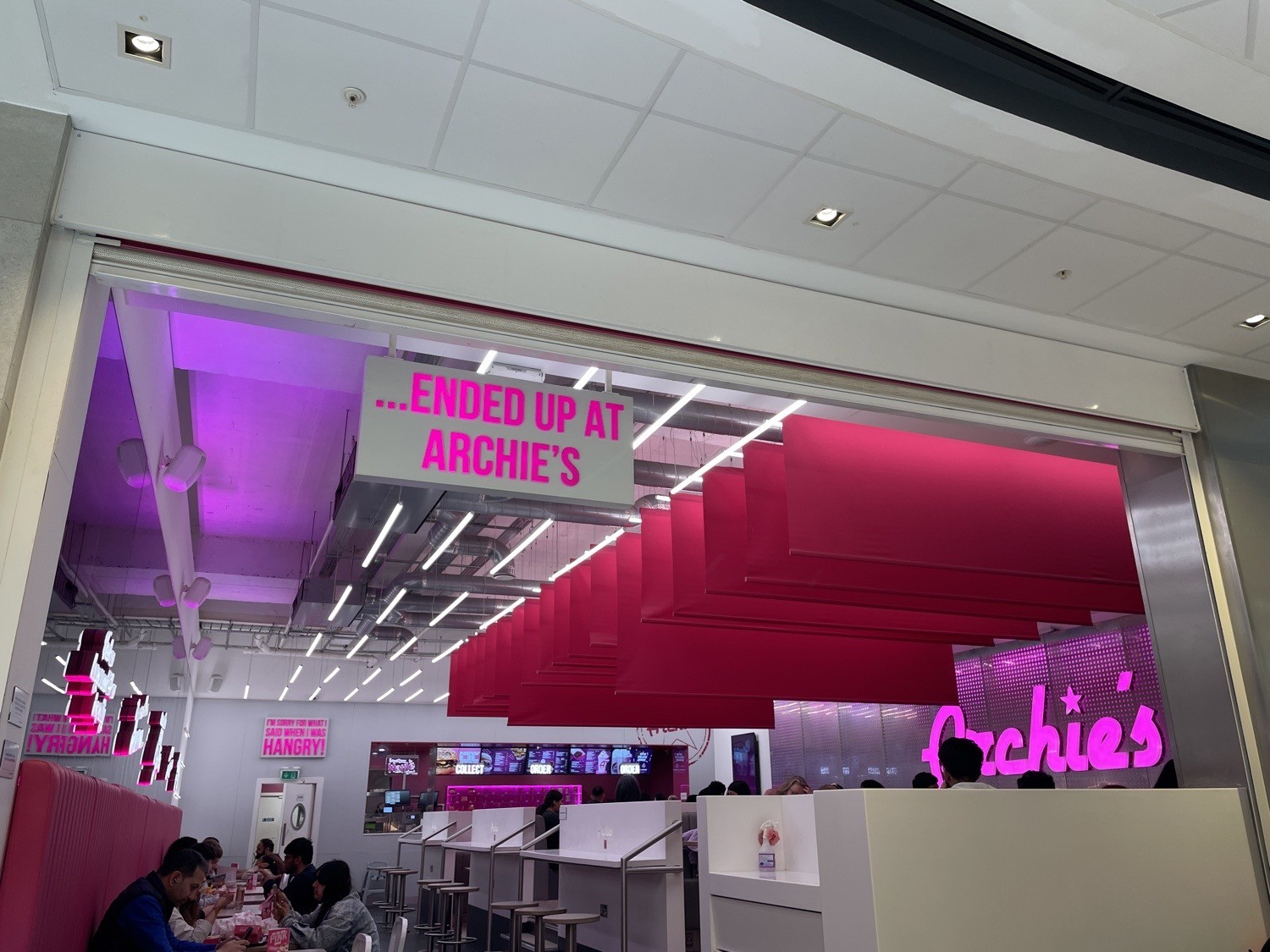 Bright pink lighting and reflective walls