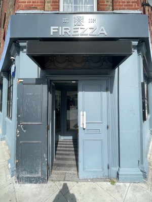 Blue double doors with handles in the centre, pull to open.