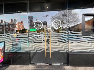 Double glass doors. Gold metal handles. Pull from centre to open.