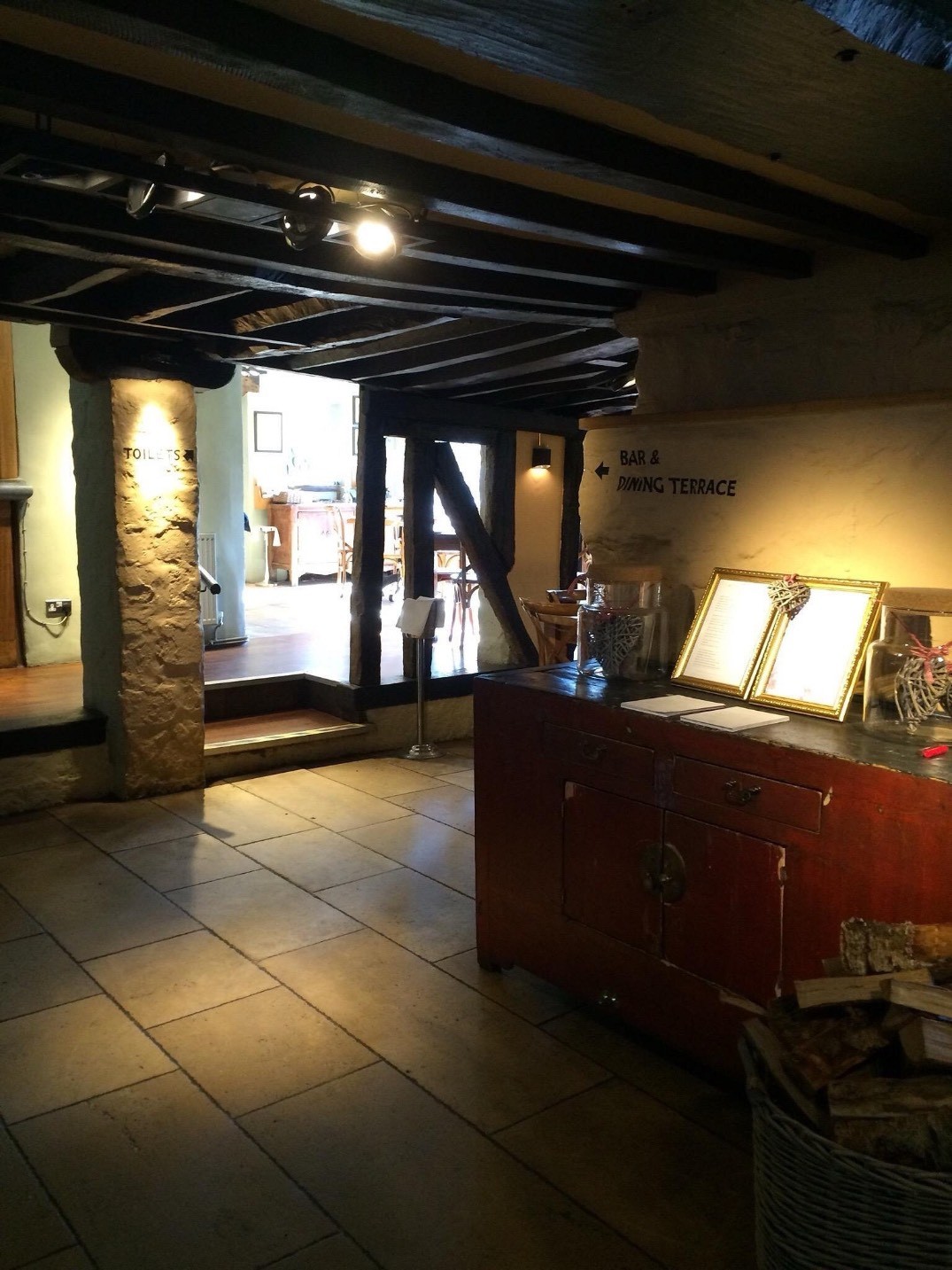 The inside entrance showing dimly lit stairs up to the main eating area.