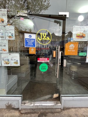 Glass door. Push open via handle on right.