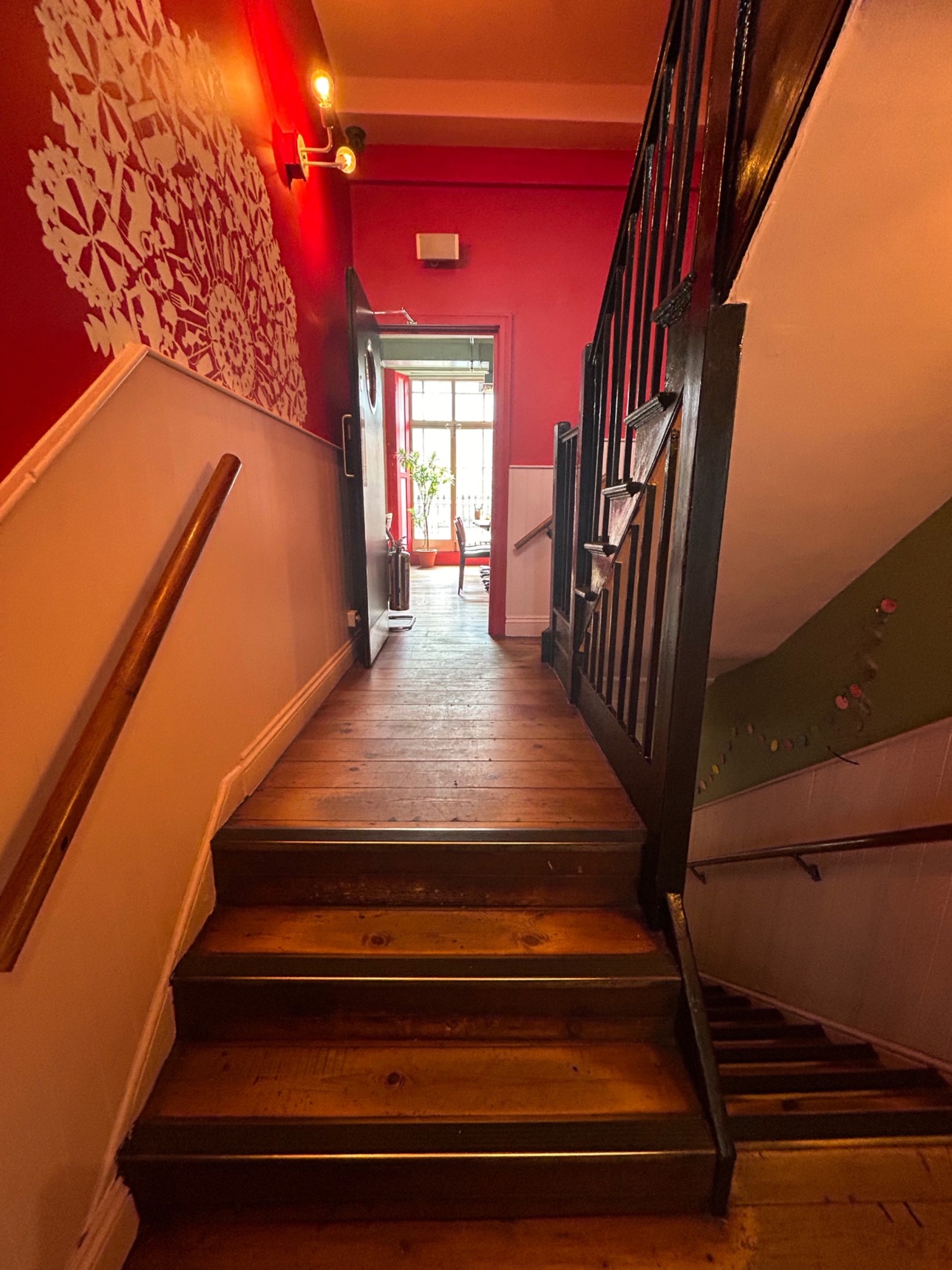 From second landing, facing right, then right ahead. Third flight of stairs ahead.
