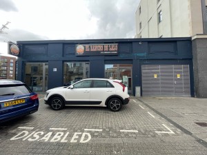 From street facing venue. Disabled parking in front of venue. Entrance in back right.
