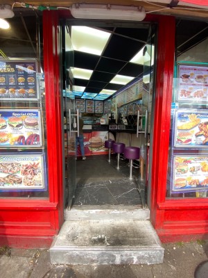 Double glass door, silver handles at centre. Push to open.