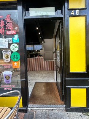 Black frame glass doors in front. Silver handle on left. Push to open.