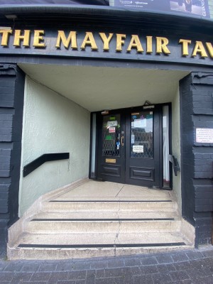 From street, facing at venue. Path ahead to entrance door.