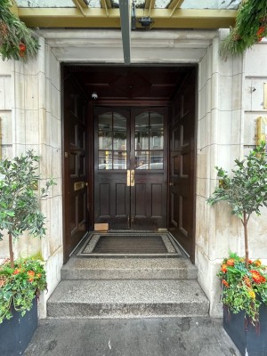 Pathway ahead leads to main entrance. 2 steps up before doorway.