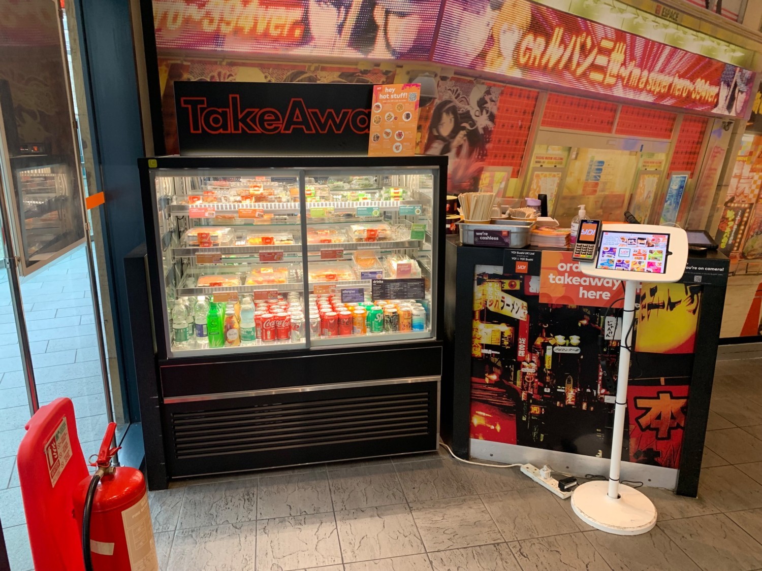 From entrance facing left. Fridge and welcome desk ahead.