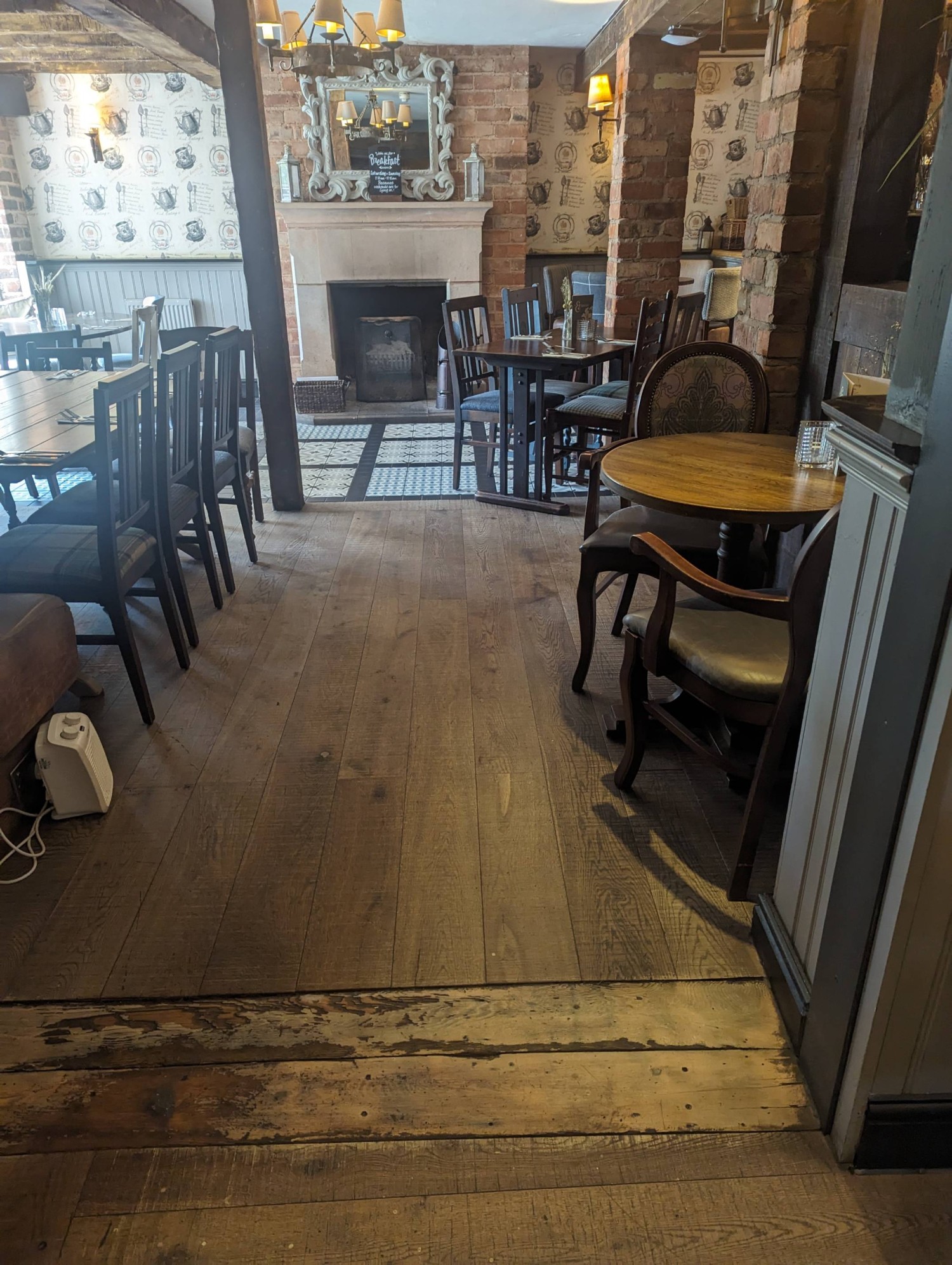 One of the main dining areas, close to the door with wide walkways