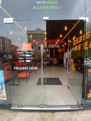 Glass doors with glass frames ahead. Push from center to open.