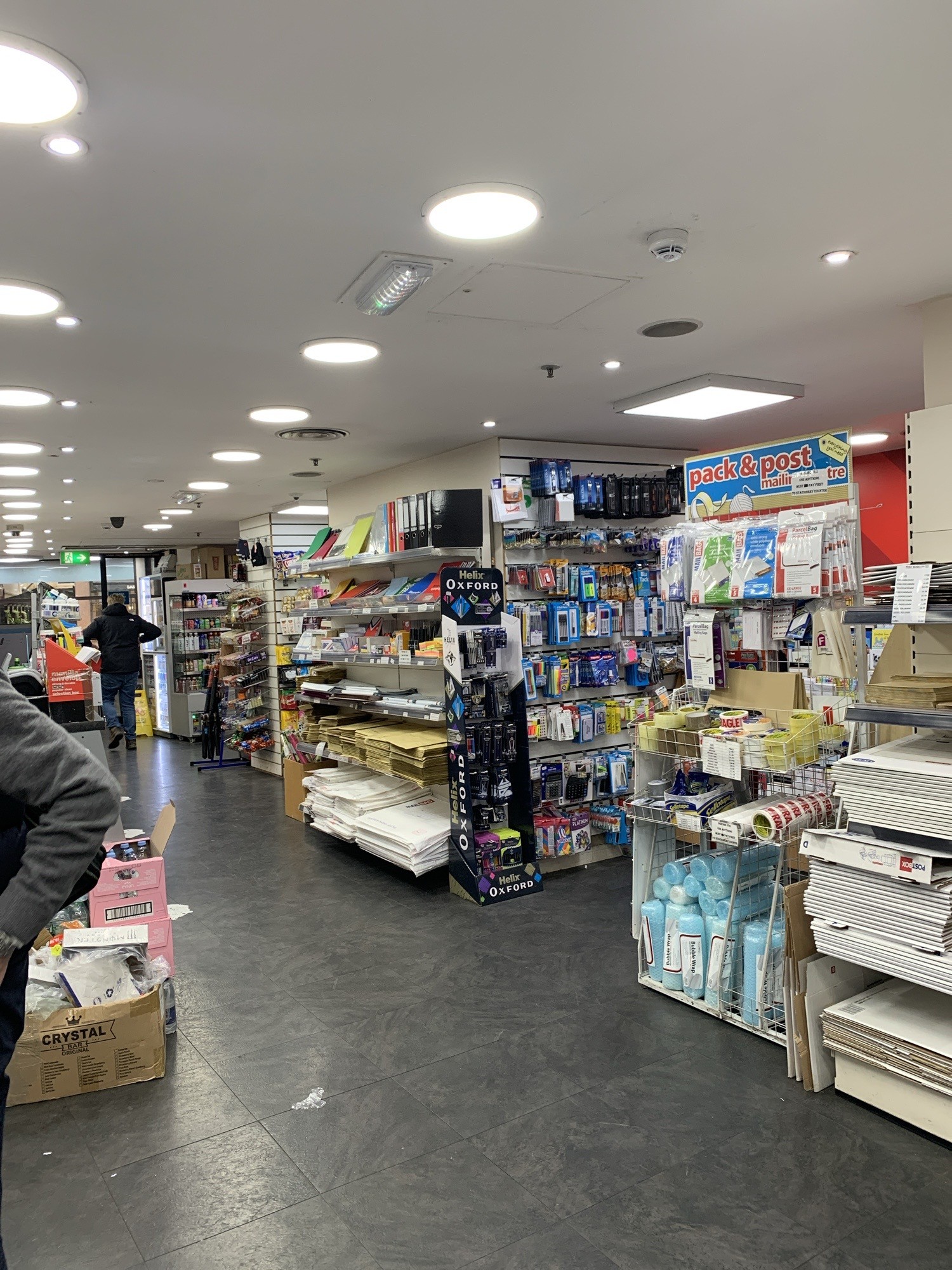 view of the aisle from the back of the store
