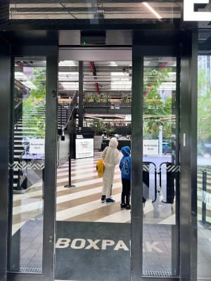 Main sliding door entrance. There is a barricade in place to help with queues on the entrance.
