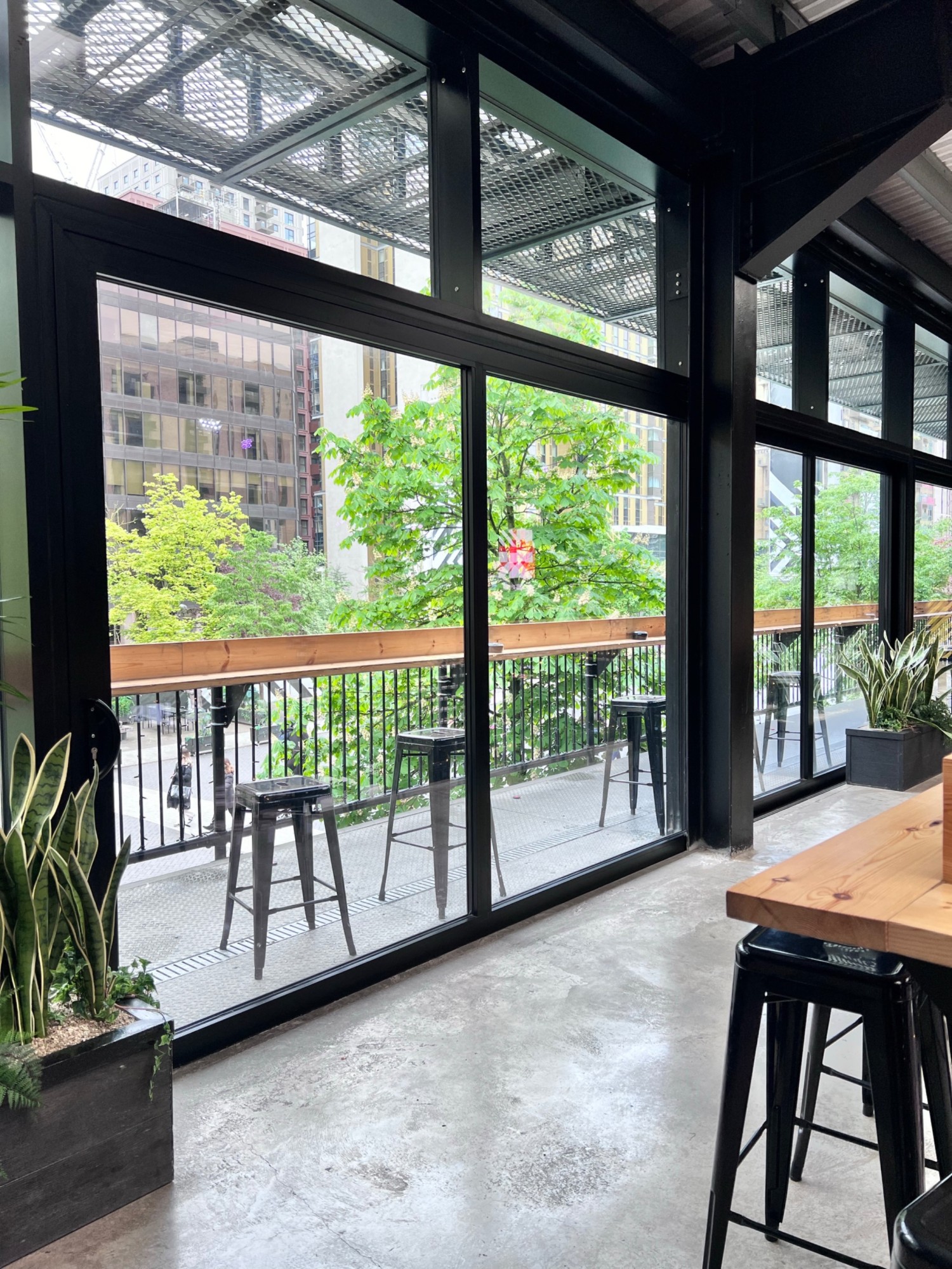 Outdoors balcony on first floor of Boxpark Wembley.