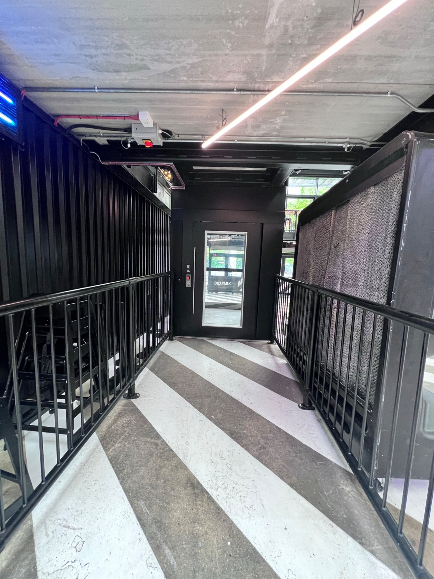 Ground floor entrance to lift, to the left of the main entrance.