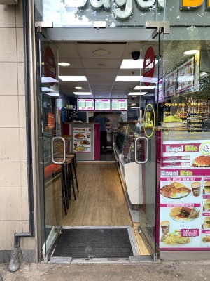 Double glass doors ahead. Push from metal handles in centre to open.