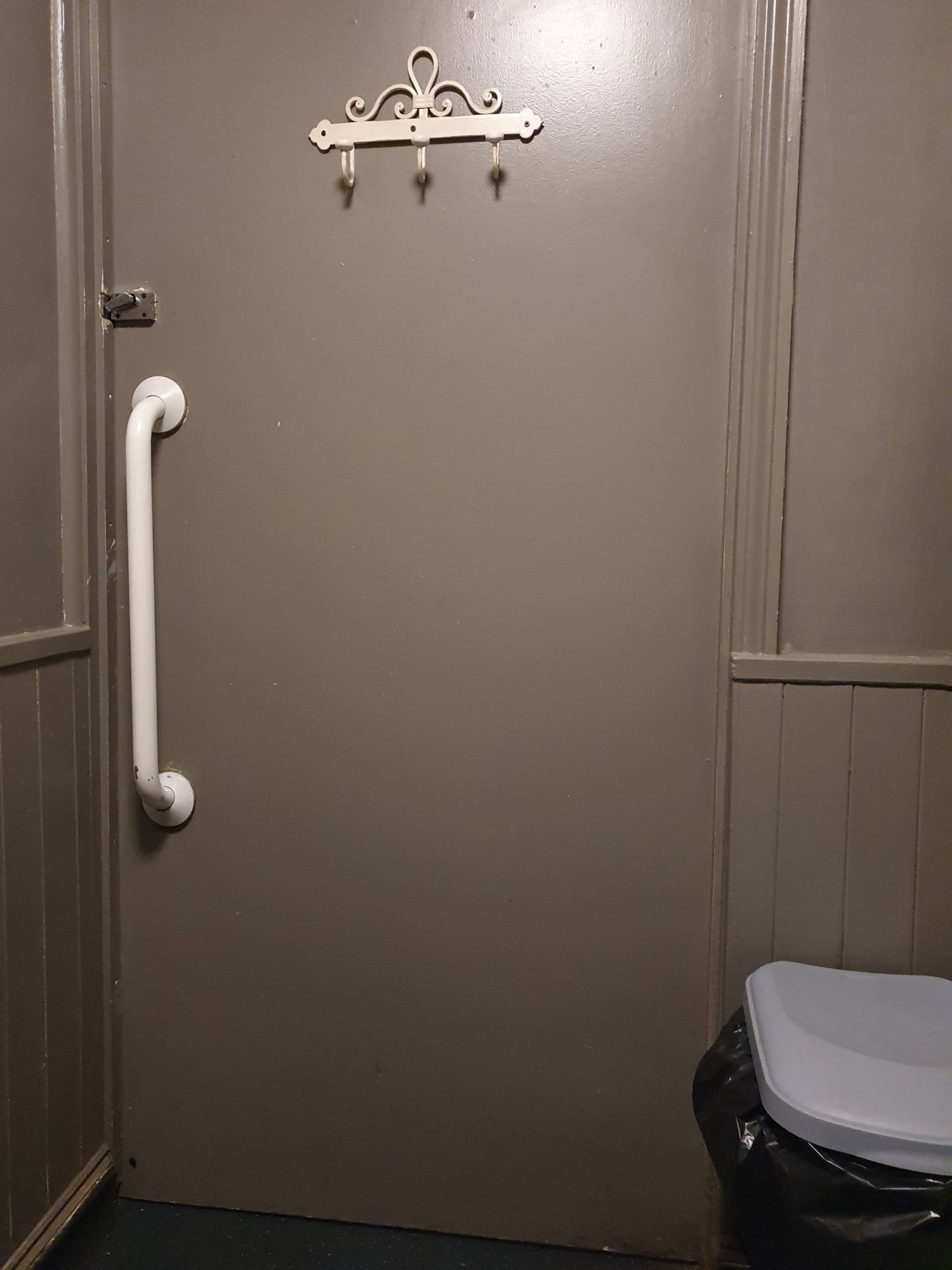 Lock and hooks on door are quite high. wheelchair users of average height with no upper body impairments should be able to reach. Large push handle
