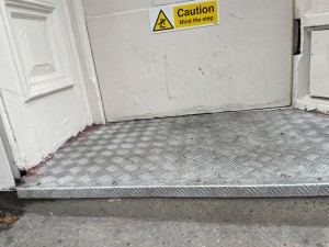 Step before the entrance door to the venue.
