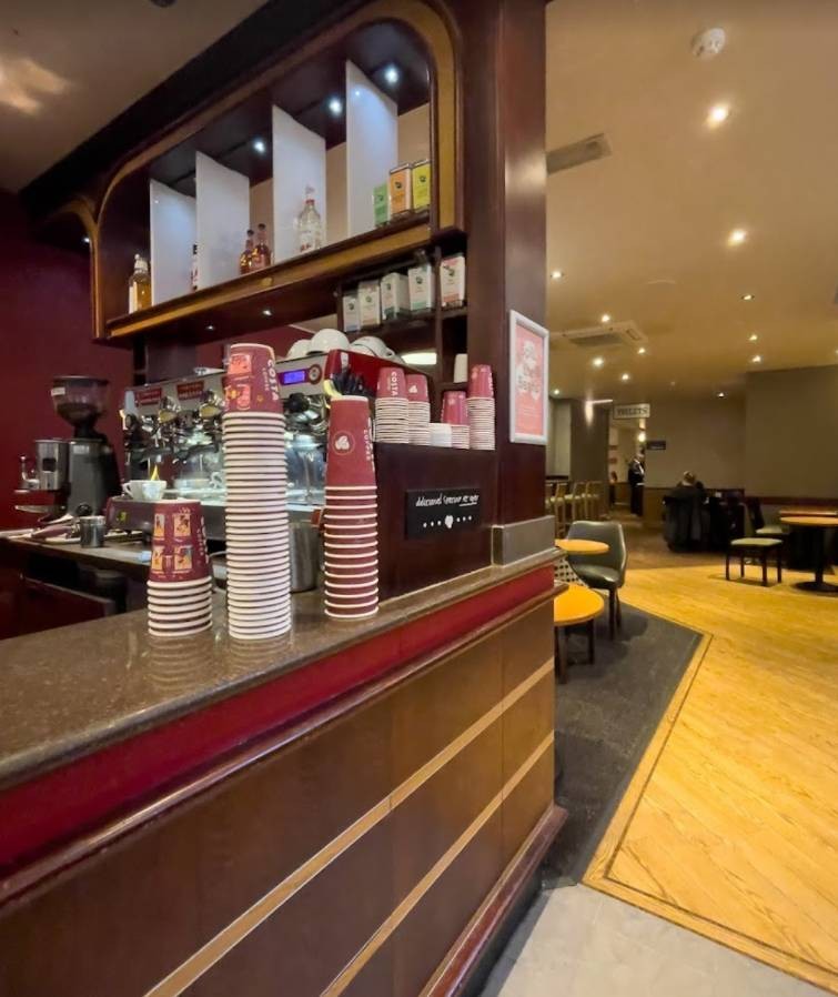 The counter where you collect your drinks. It is too high if you are seated height. Beyond this counter the narrow walkway opens out into larger space