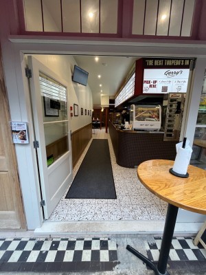 White framed glass double doors. Push open via handle in centre.