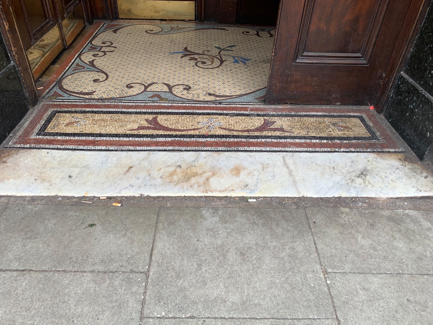 Small raised edge over threshold of doorway.