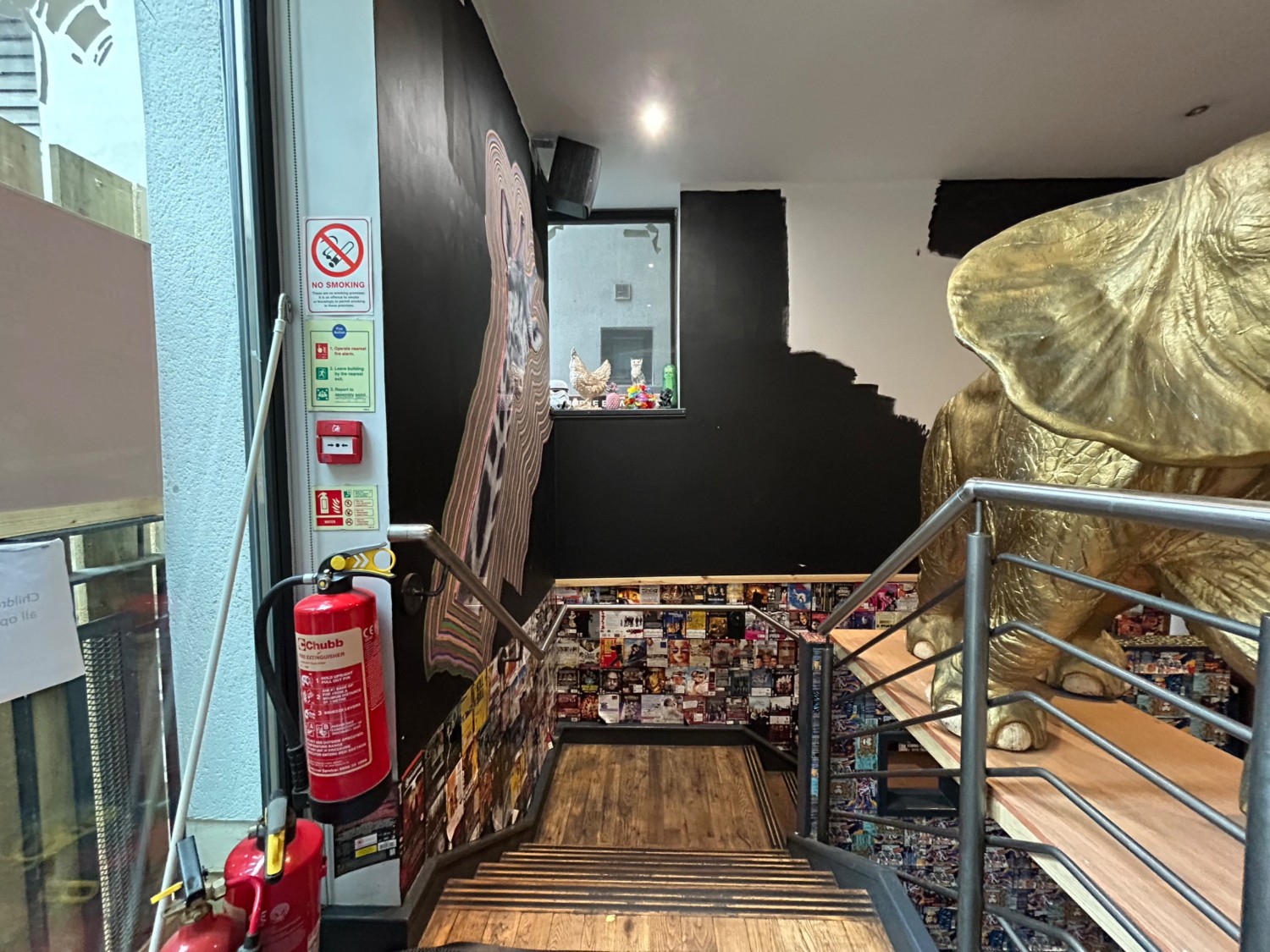 From entrance, facing left. Stairs down to toilet ahead.