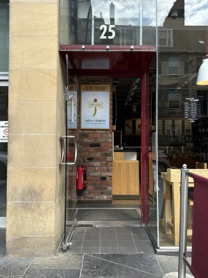 Small ramp to enter with door opening outwards from right to left. Slight bump at door frame.