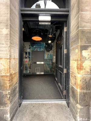 Black double doors. Push from centre to open.