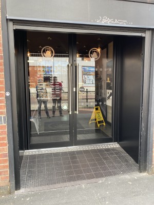 Double doors with handles and small ramp.