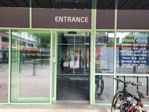 Wide automatic sliding door entrance into lobby.