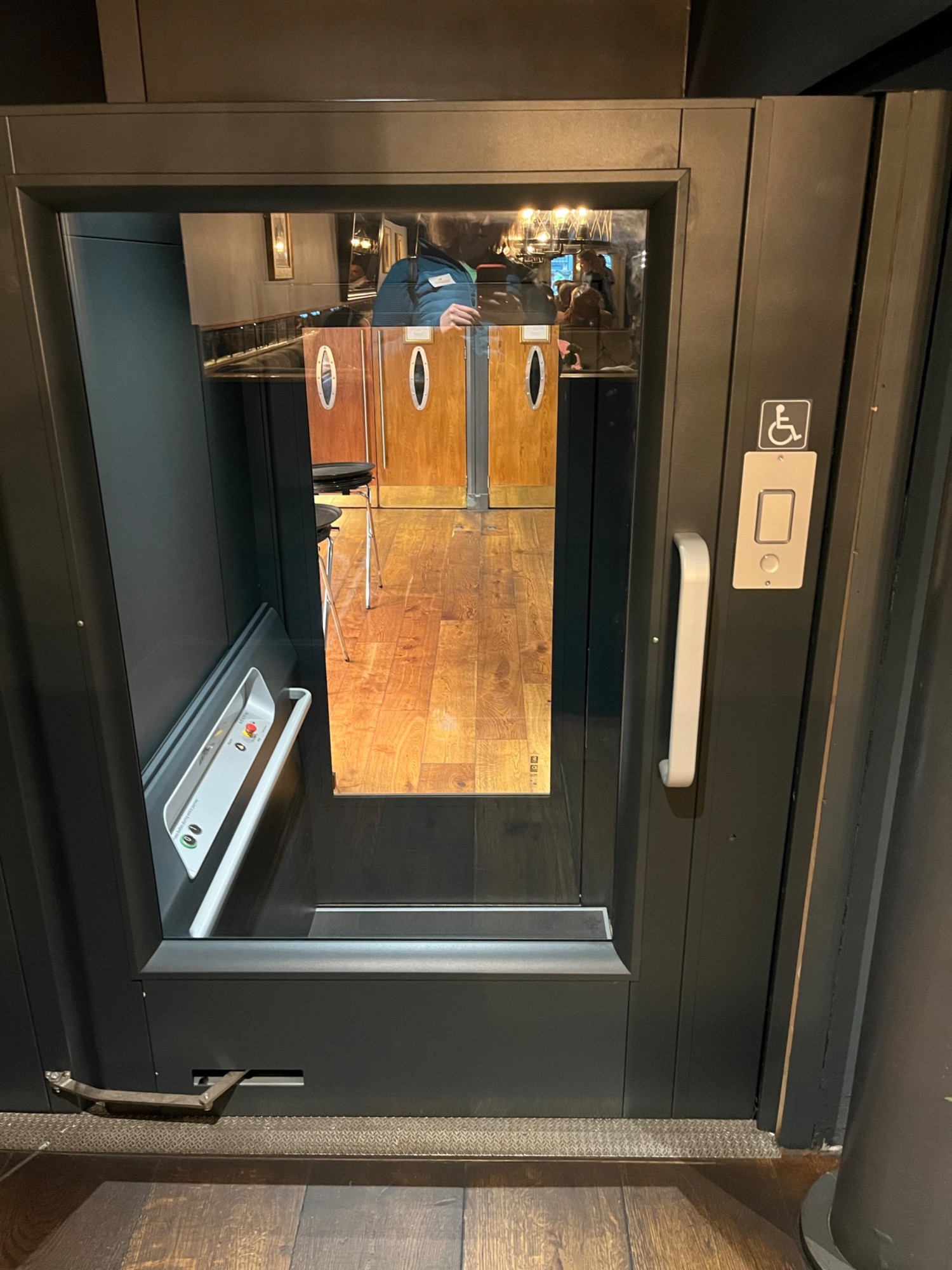 The lift at the rear of the main seating area that takes you down to the accessible toilet