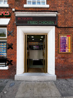 One step up to glass doors ahead. Push from handles in centre to open.