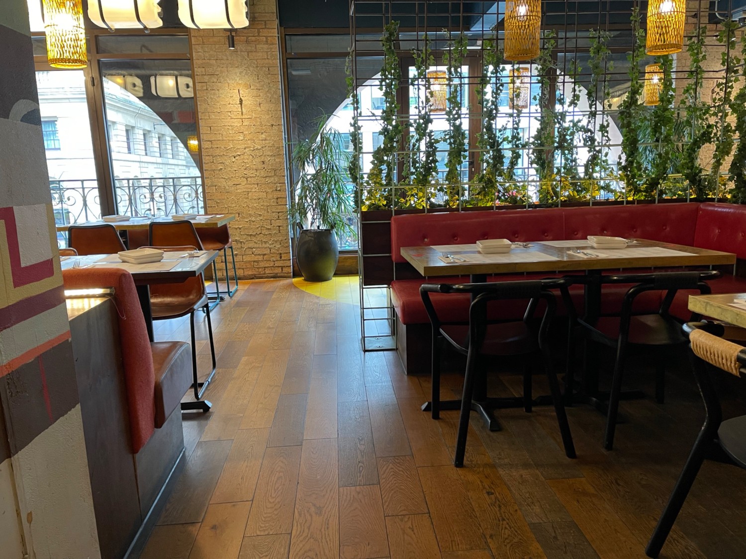 Entrance to second floor from the stairs. Tables and chairs on left and right