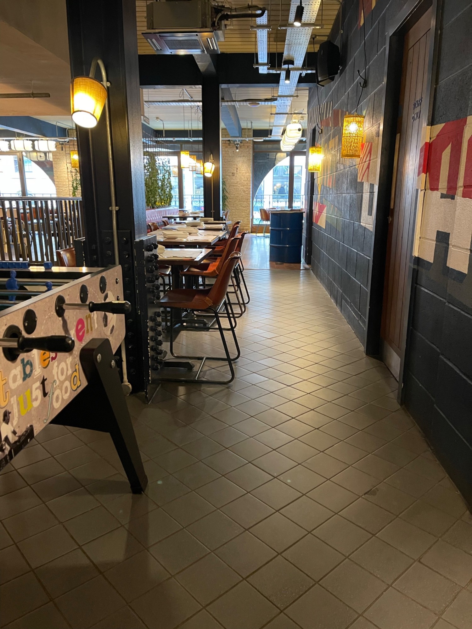Entrance to the second floor from the lift with table football on left side