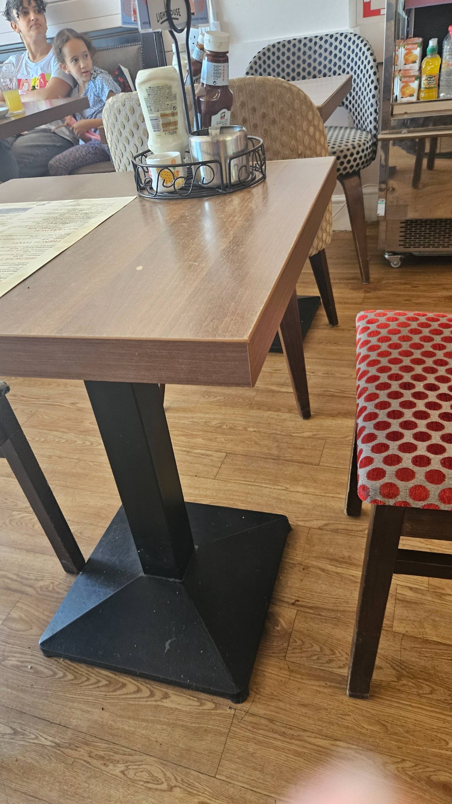 Wooden tables and chairs. Lots of space