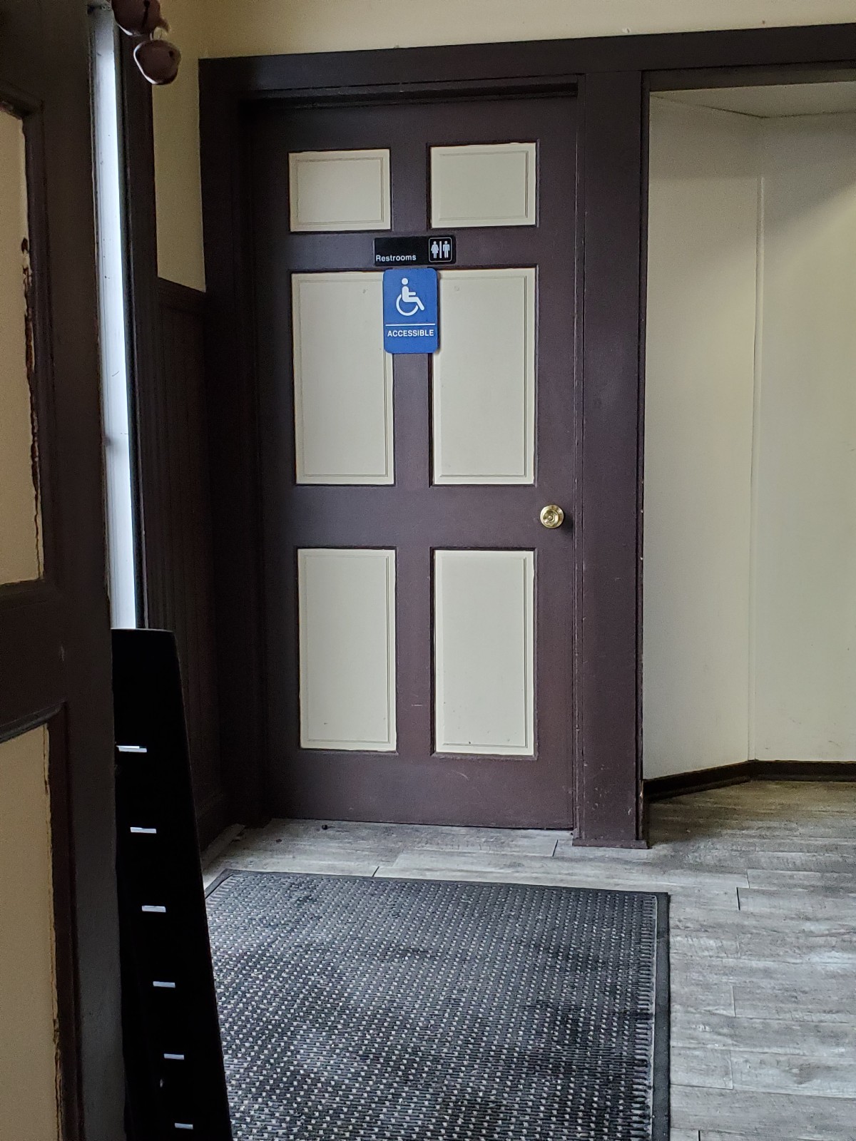 There is a separate handicap bathroom in the entrance that has transfer rails, accessible by wheelchair, with a wide door & turn around space inside