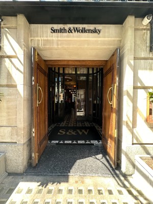 Wooden doors. Gold handles inside of doors that are pushed open from the inside.