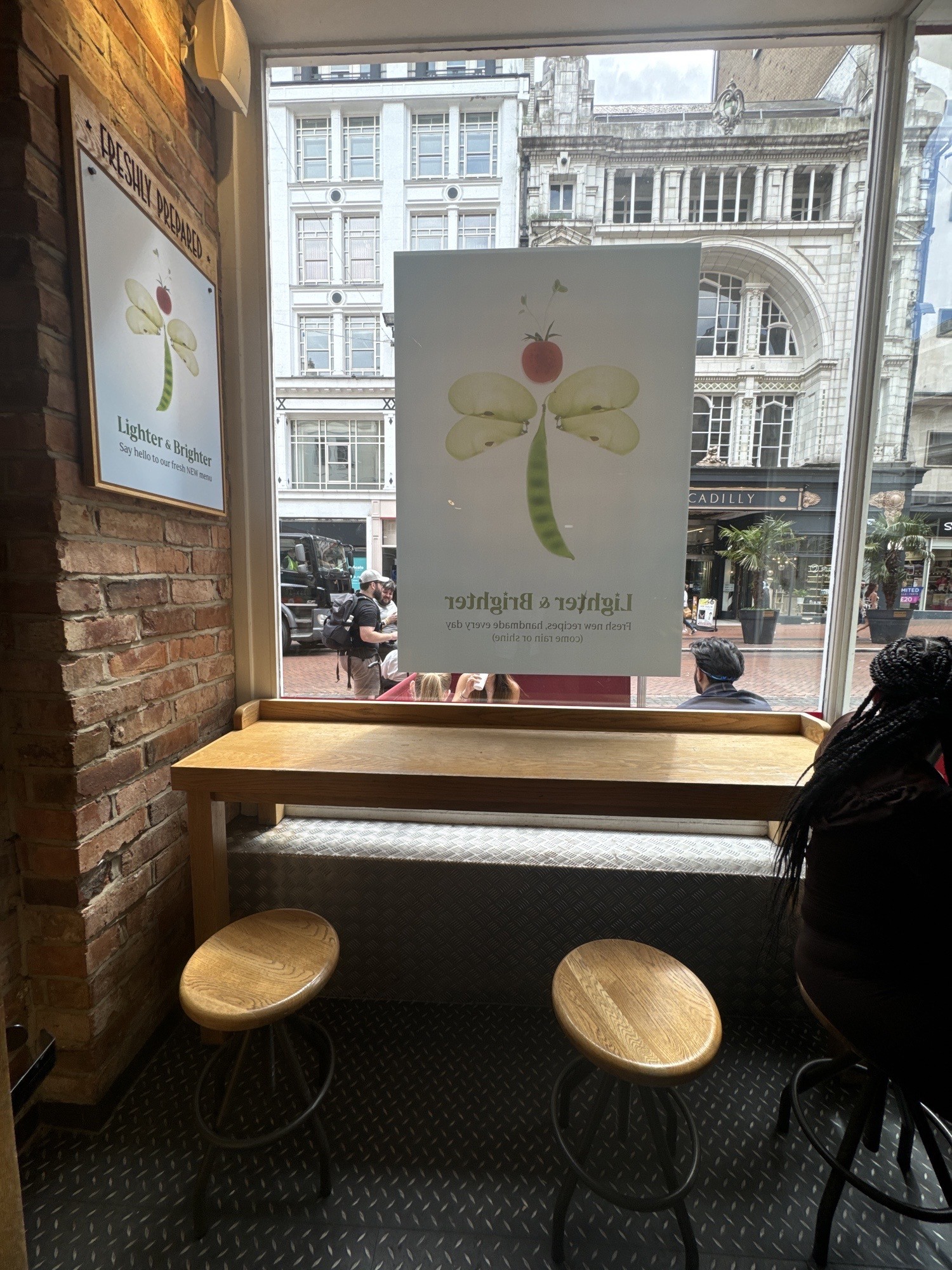 Small counter with stools immediately to the right after entering