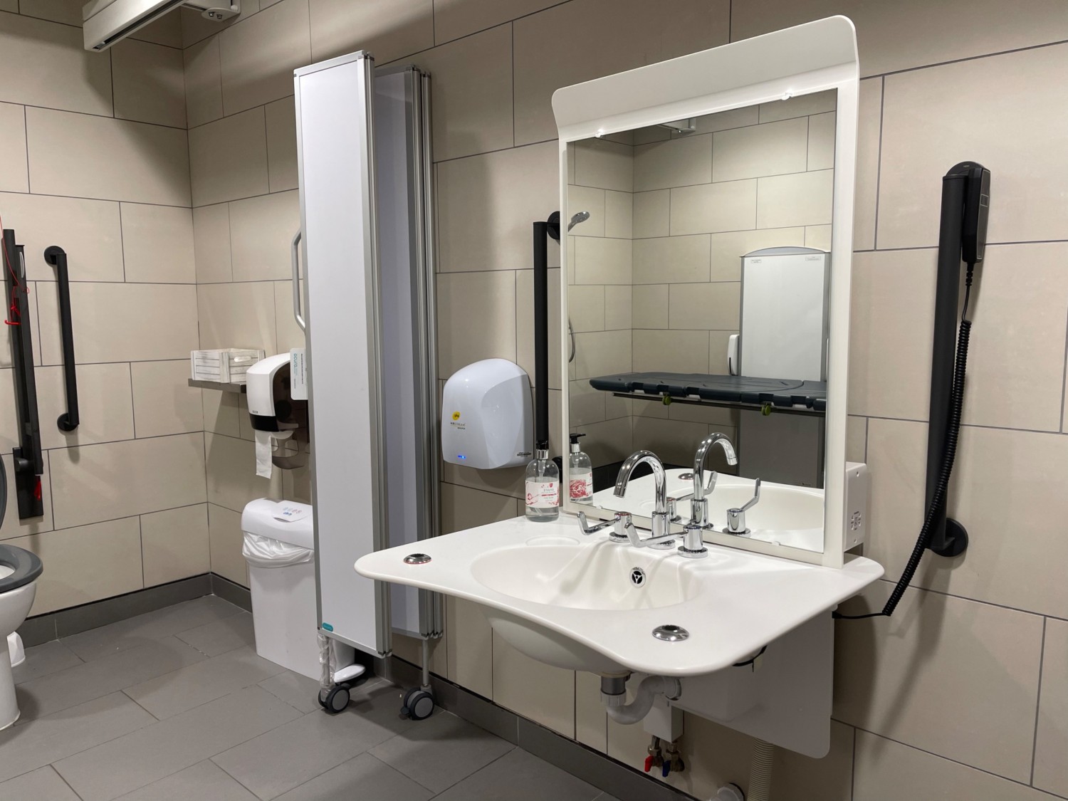 Height adjustable sink with mixer taps left hot right cold