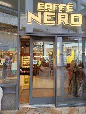 Glass door with grey frame ahead.