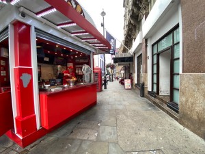 From street, facing at venue. Pathway along right. Counter along left.